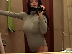 hey, check this busty babe fingering her hairy bush in the bathroom