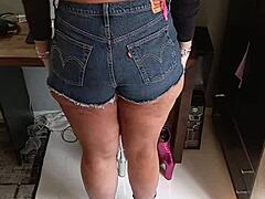 Wearing sexy shorts with tan lines on beautiful tanned body