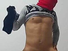 Newbie in the classroom bends over to flash and masturbate with an inflated condom for quick solo thrill.