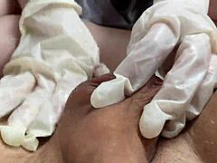 Subtle hand relief by young Russian in shiny gloves POV