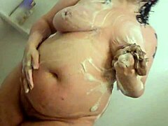 Whoa, check this hidden cam catching a curvy BBW milf getting all wet in the shower! 🚿