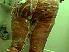 Whoa, check this hidden cam catching a curvy BBW milf getting all wet in the shower! 🚿