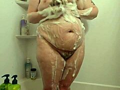Whoa, check this hidden cam catching a curvy BBW milf getting all wet in the shower! 🚿
