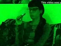 beth kinky as sexy goth domina smokes cigarette in green light hd