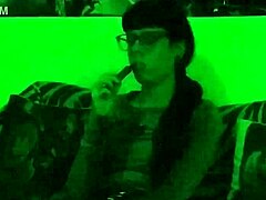 beth kinky as sexy goth domina smokes cigarette in green light hd