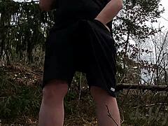 chubbykaot explores the forest solo with belly flashing in outdoor nature setting