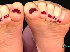 this barefoot DOMINATION scene has a tattooed housewife with glasses using her feet and toes for FEMDOM fetish on him