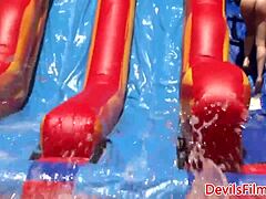 wet lesbians dive into strapon fucking during intense outdoor orgy action