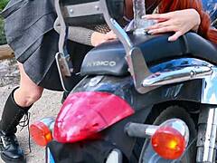 Latina rides dildo outdoors on motorcycle